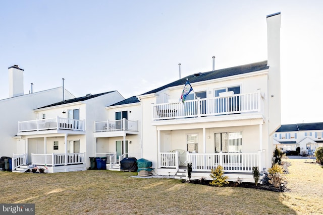 back of house featuring a yard