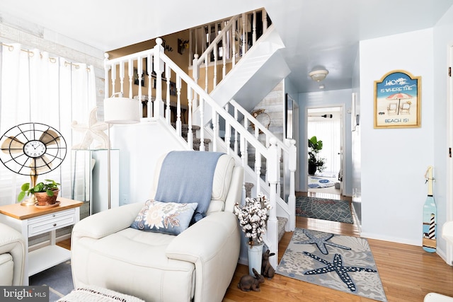 interior space featuring wood-type flooring and a healthy amount of sunlight