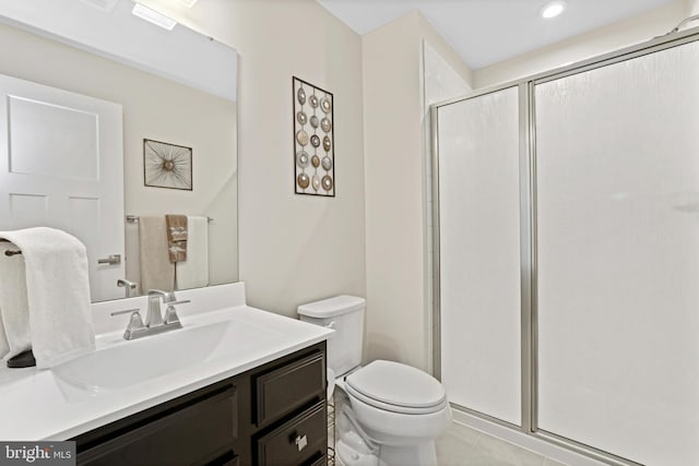 bathroom with toilet, a stall shower, vanity, and tile patterned floors