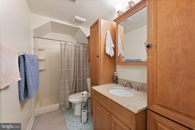 bathroom featuring vanity, tile patterned flooring, a shower with curtain, and toilet