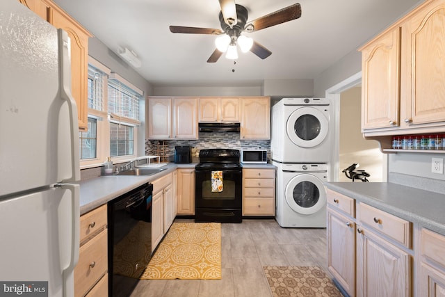 kitchen with stacked washer and dryer, sink, tasteful backsplash, black appliances, and light brown cabinets