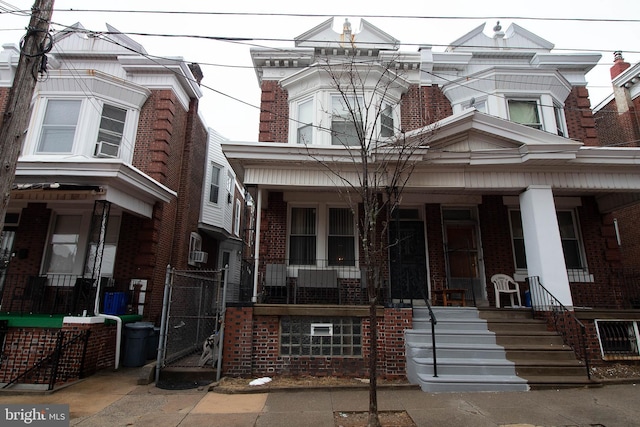 townhome / multi-family property with covered porch