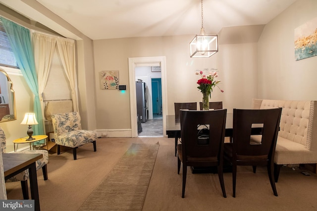 dining space with carpet