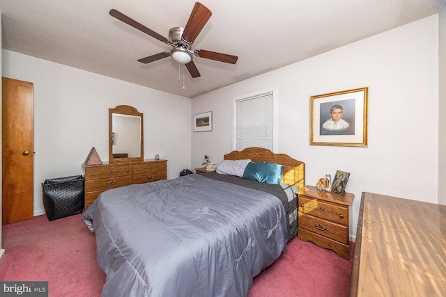 bedroom featuring ceiling fan and carpet