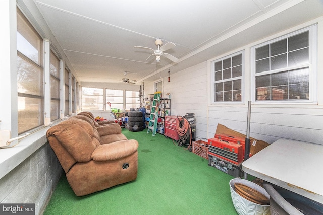 sunroom featuring ceiling fan