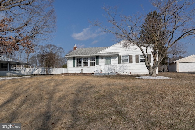 view of front facade featuring a garage and a front lawn