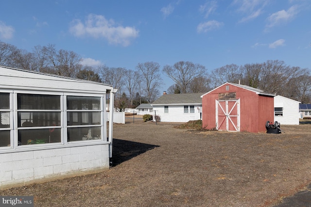 exterior space featuring a storage shed