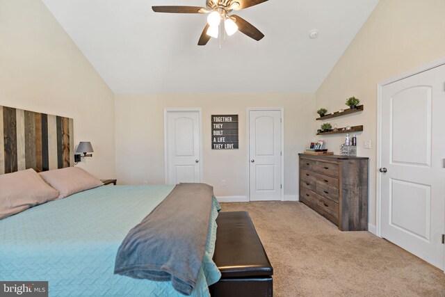 bedroom featuring ceiling fan, light colored carpet, and lofted ceiling