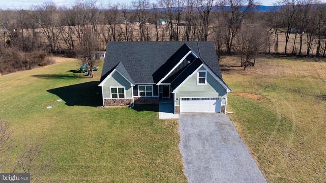 view of front of home featuring a garage and a front lawn