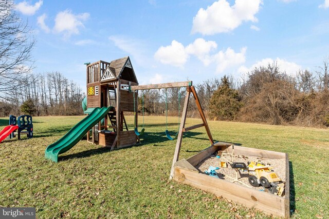 view of playground with a yard