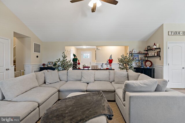 living room featuring vaulted ceiling and ceiling fan