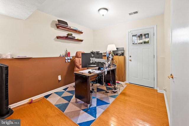 office with hardwood / wood-style floors