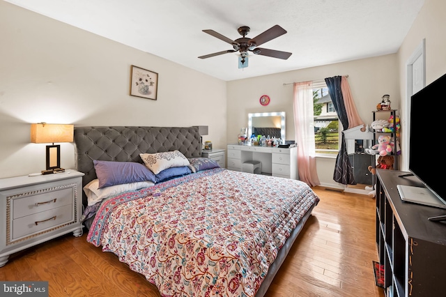 bedroom with ceiling fan and light hardwood / wood-style flooring