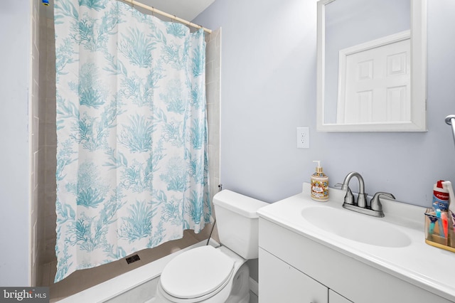 bathroom with vanity, a shower with curtain, and toilet