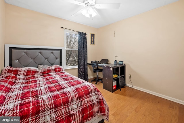 bedroom with wood-type flooring and ceiling fan