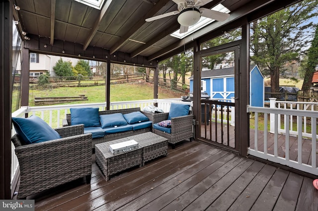 sunroom / solarium with plenty of natural light and ceiling fan