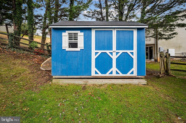 view of outdoor structure with a lawn