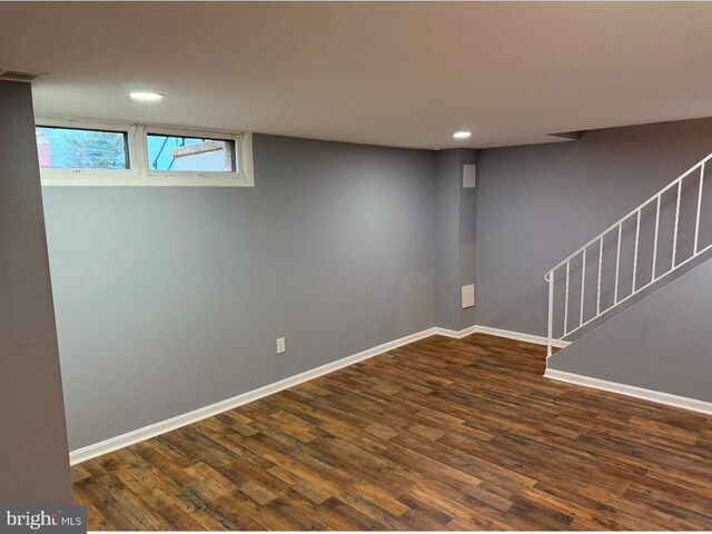 basement featuring dark hardwood / wood-style floors