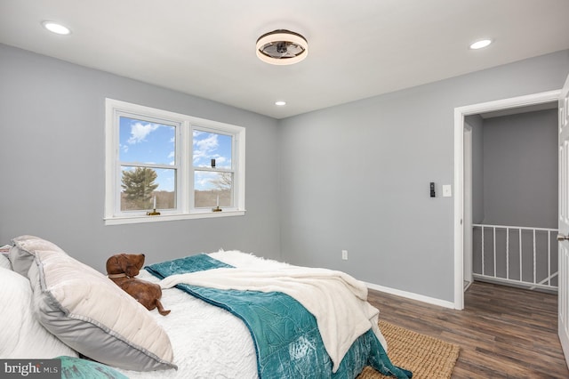 bedroom featuring dark hardwood / wood-style flooring