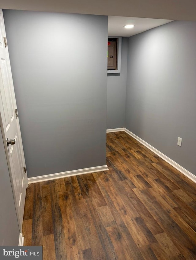 spare room featuring dark hardwood / wood-style flooring