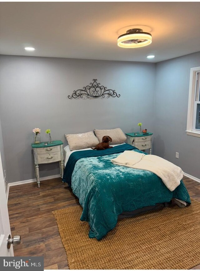 bedroom featuring dark hardwood / wood-style flooring