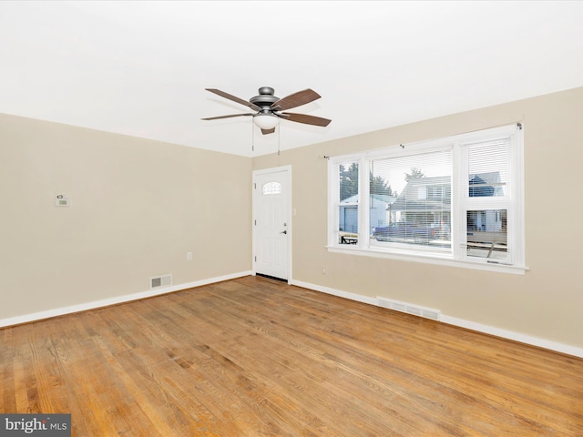 spare room featuring ceiling fan and light wood-type flooring