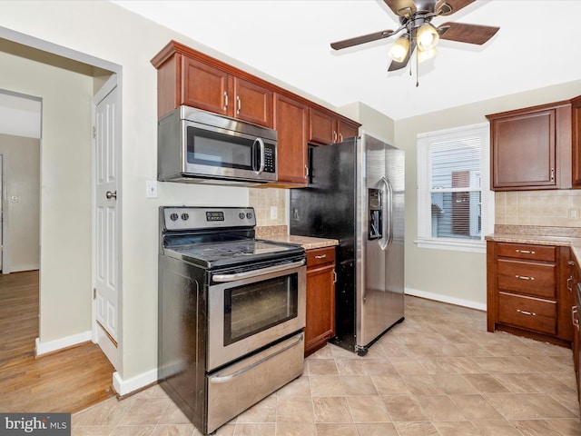 kitchen with stainless steel appliances, backsplash, and ceiling fan