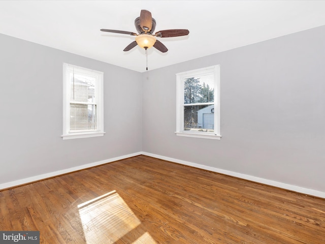 empty room with wood-type flooring and ceiling fan