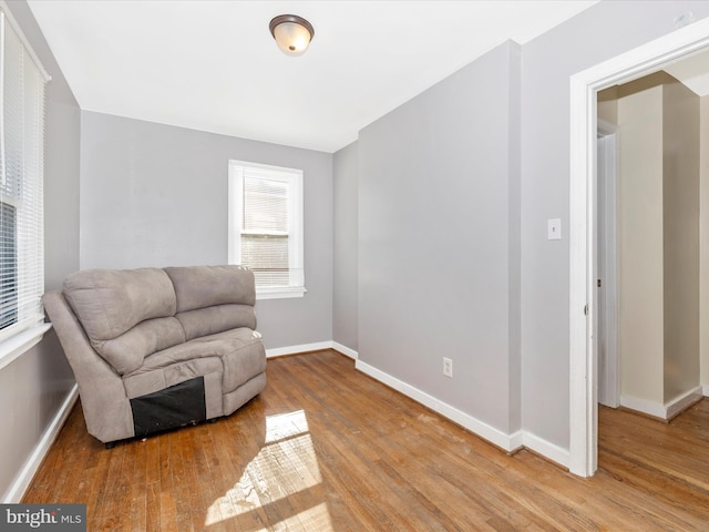 sitting room with light hardwood / wood-style flooring