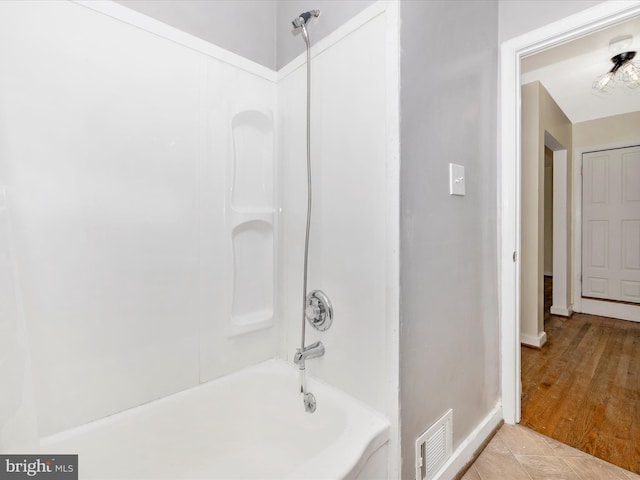 bathroom featuring shower / tub combination and tile patterned floors