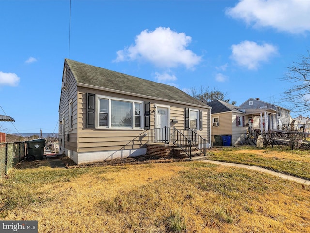 bungalow-style home featuring a front lawn