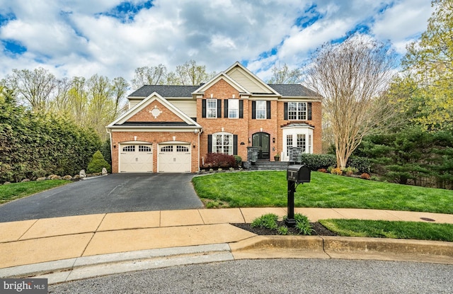 19 Longwood Ln, Newark, DE 19711 - view of front of home featuring an attached garage, a front yard, driveway, and brick siding