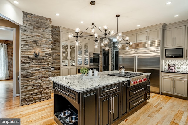 19 Longwood Ln, Newark, DE 19711 - kitchen featuring pendant lighting, light stone countertops, recessed lighting, appliances with stainless steel finishes, and backsplash