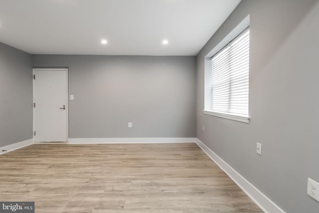 spare room featuring light hardwood / wood-style floors