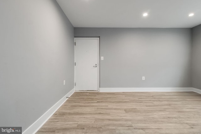 unfurnished room with light wood-type flooring