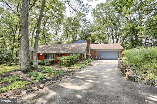 single story home featuring a garage