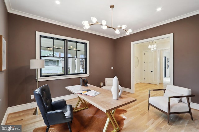 office space featuring ornamental molding, light wood finished floors, baseboards, and a notable chandelier