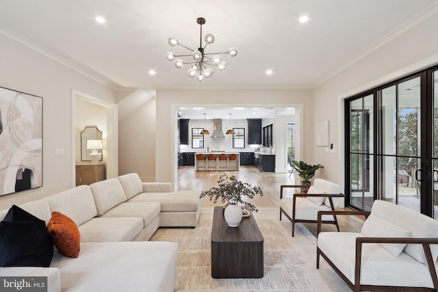 living area featuring ornamental molding, recessed lighting, a healthy amount of sunlight, and light wood finished floors