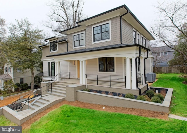 view of front of home featuring fence, central AC unit, a porch, and a front yard