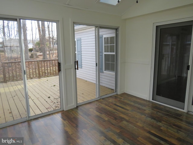 unfurnished sunroom featuring lofted ceiling