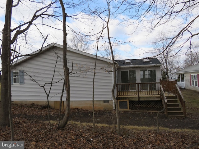 view of home's exterior with a deck