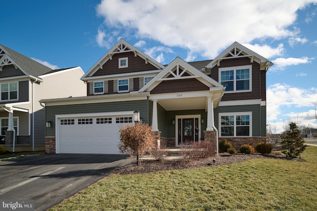 craftsman-style home with a garage and a front lawn