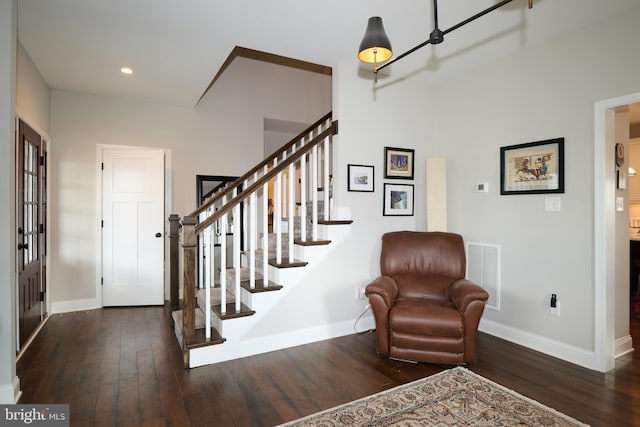 foyer with dark hardwood / wood-style flooring