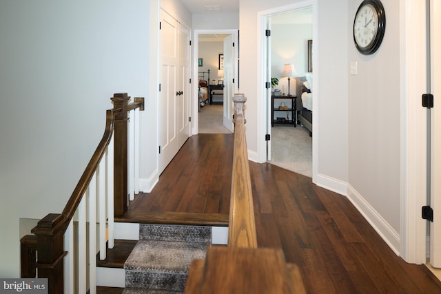 corridor featuring dark wood-type flooring