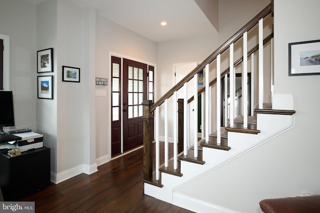 entrance foyer with dark hardwood / wood-style flooring