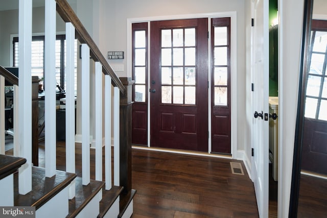 entryway with dark wood-type flooring