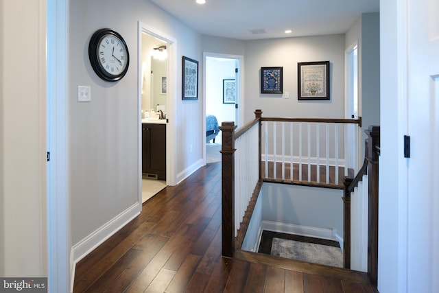 hall featuring sink and dark hardwood / wood-style floors