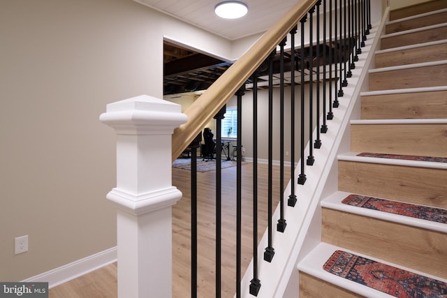 stairway with wood-type flooring