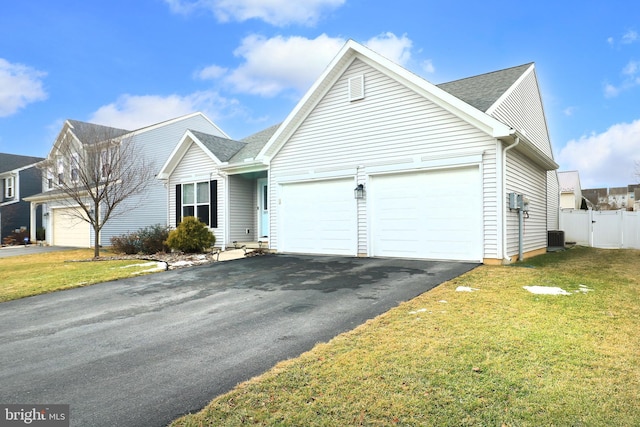 front of property featuring a garage and a front lawn