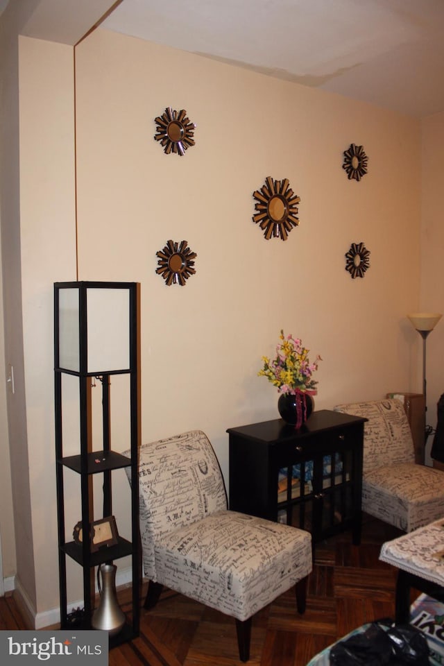 living area with parquet flooring